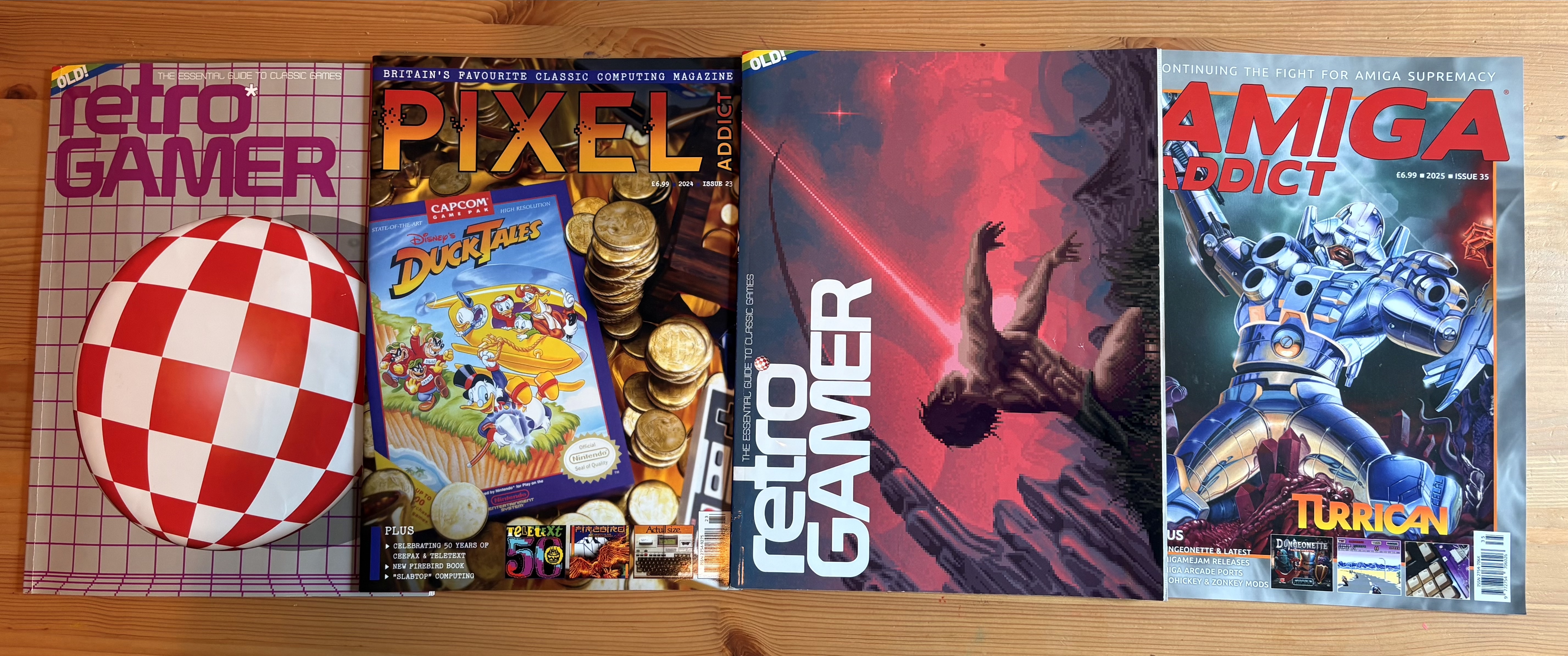 Four magazine covers: two are Retro Gamer magazine, one is Amiga Addict and another is Pixel Addict